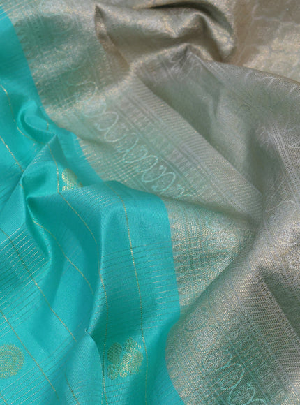 Pure kanchipuram silk saree teal blue shade and pastel grey with allover zari checks & annam buttas and zari woven border & aari work blouse