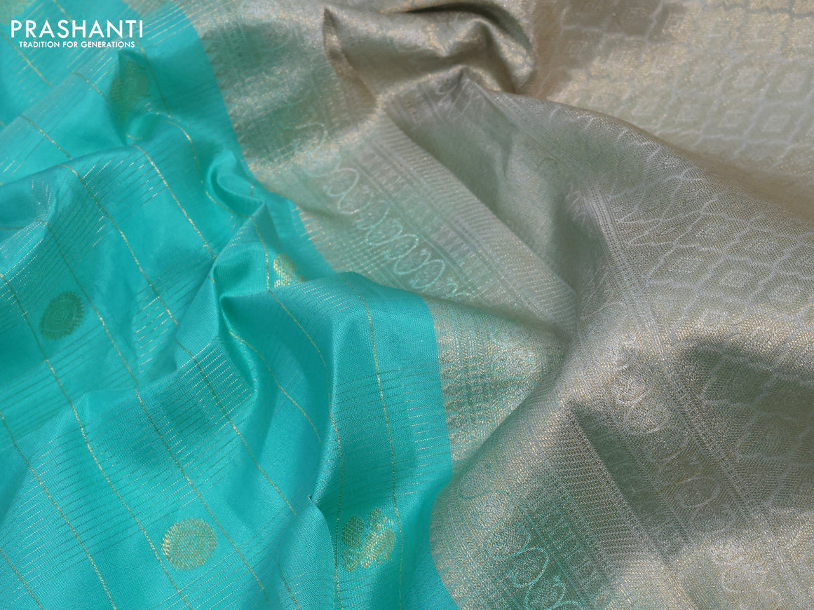 Pure kanchipuram silk saree teal blue shade and pastel grey with allover zari checks & annam buttas and zari woven border & aari work blouse