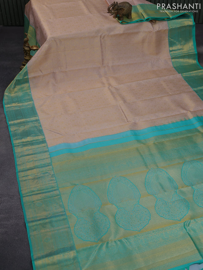 Pure kanchipuram silk saree pastel pink and teal blue with allover zari woven brocade weaves and zari woven border & aari work blouse