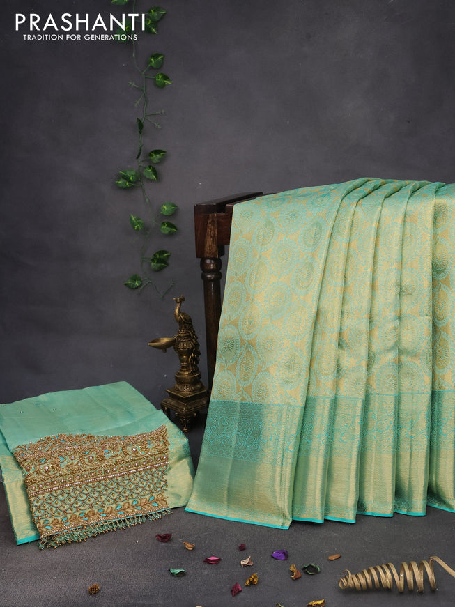 Pure kanchipuram tissue silk saree teal blue shade with allover zari woven brocade weaves and long zari woven border & aari work blouse