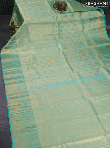 Pure kanchipuram tissue silk saree teal blue shade with allover zari woven brocade weaves and long zari woven border & aari work blouse