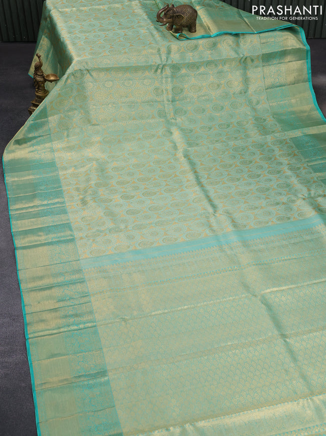 Pure kanchipuram tissue silk saree teal blue shade with allover zari woven brocade weaves and long zari woven border & aari work blouse