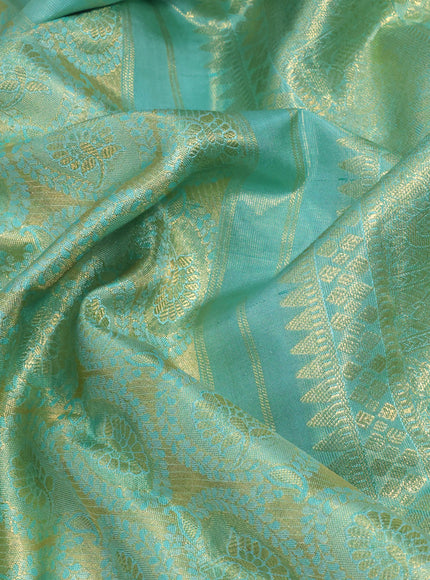 Pure kanchipuram tissue silk saree teal blue shade with allover zari woven brocade weaves and long zari woven border & aari work blouse