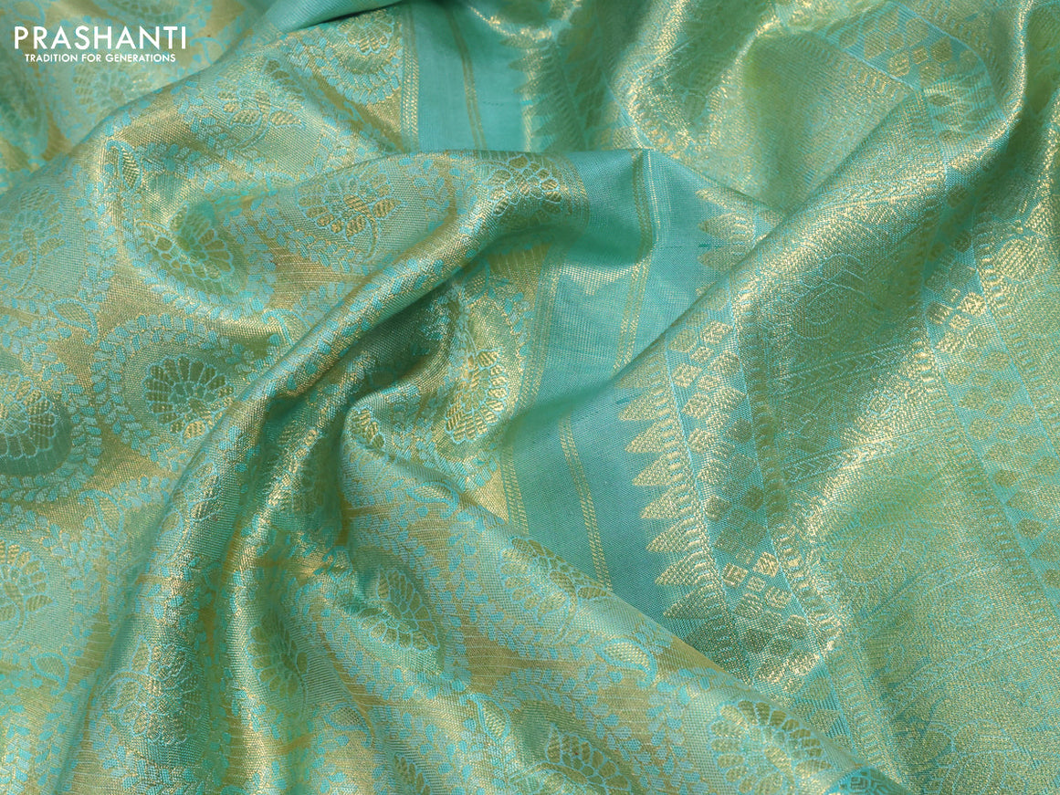 Pure kanchipuram tissue silk saree teal blue shade with allover zari woven brocade weaves and long zari woven border & aari work blouse