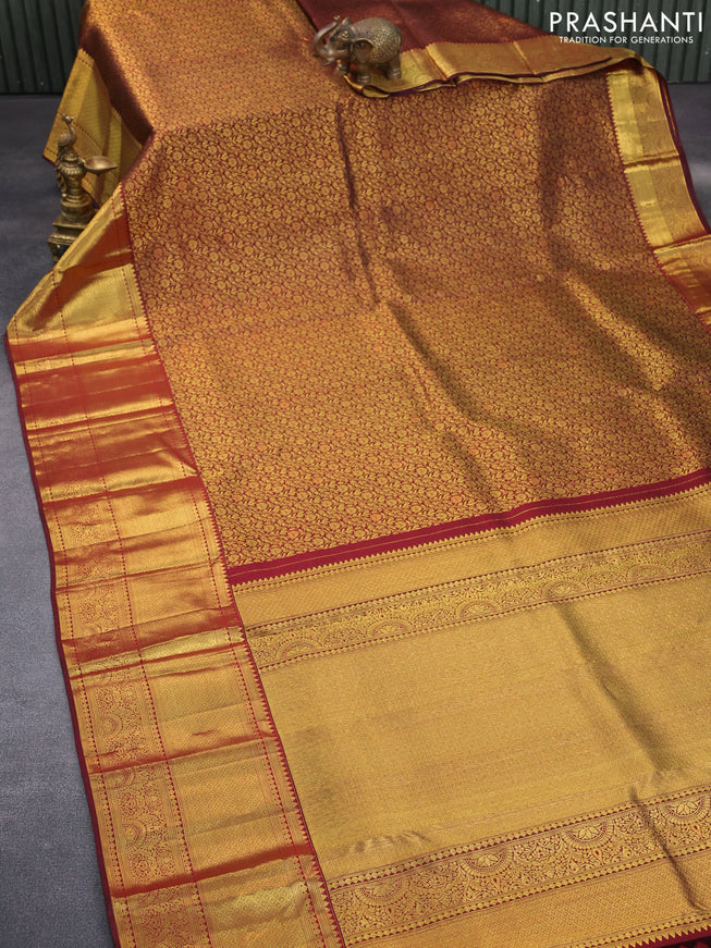 Pure kanchipuram silk saree maroon with allover zari woven brocade weaves and long zari woven border & aari work blouse