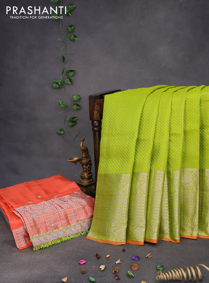 Pure kanchipuram silk saree light green and orange with allover silver zari woven brocade weaves and long zari woven border & aari work blouse