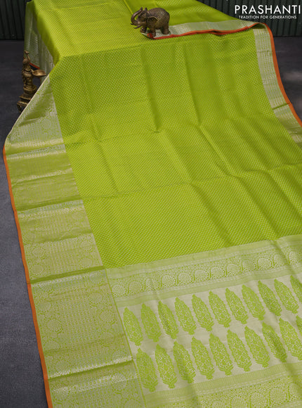 Pure kanchipuram silk saree light green and orange with allover silver zari woven brocade weaves and long zari woven border & aari work blouse