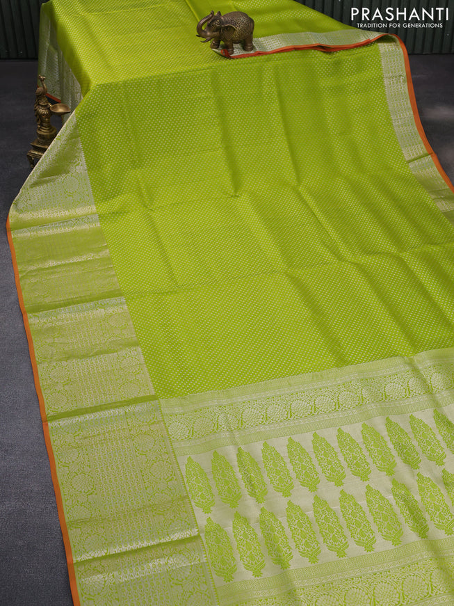 Pure kanchipuram silk saree light green and orange with allover silver zari woven brocade weaves and long zari woven border & aari work blouse