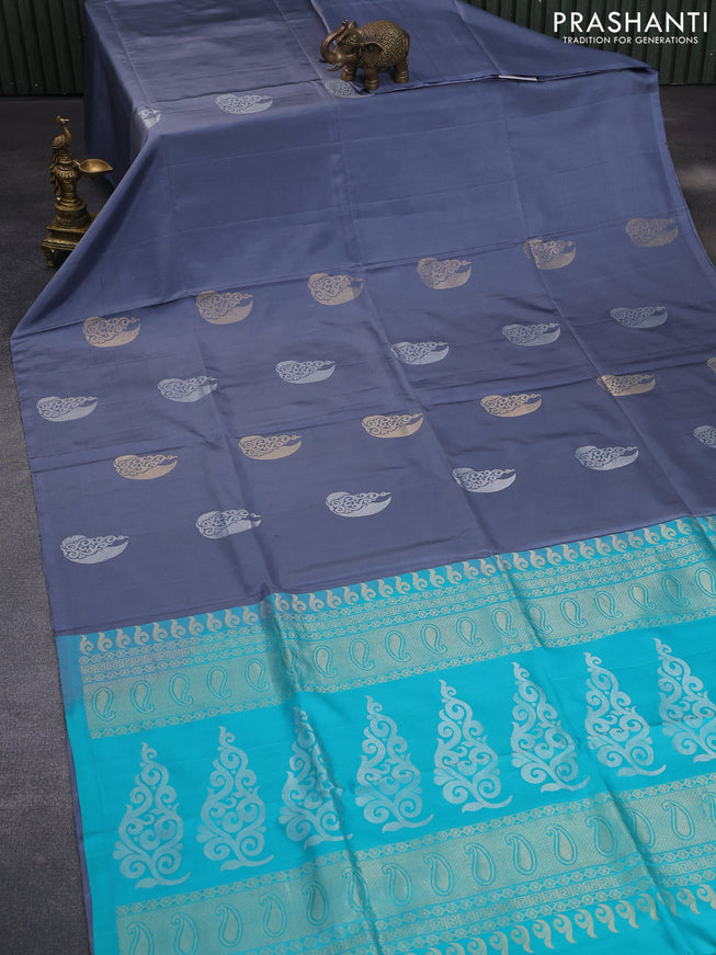 Pure kanchipuram silk saree grey and teal blue with plain body in borderless style & aari work blouse