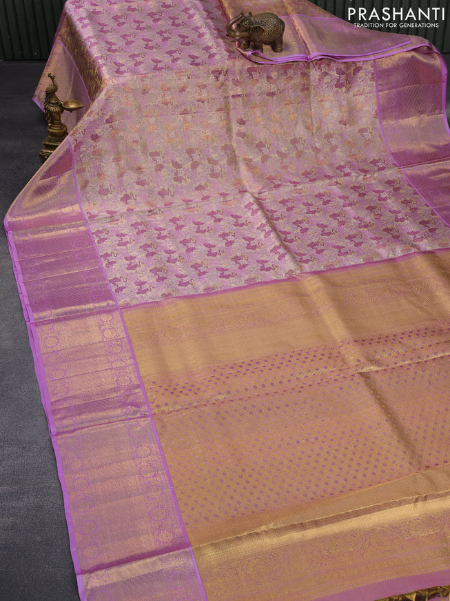 Pure kanchipuram silk saree gold and lavender shade with allover zari woven brocade weaves and long zari woven border & aari work blouse