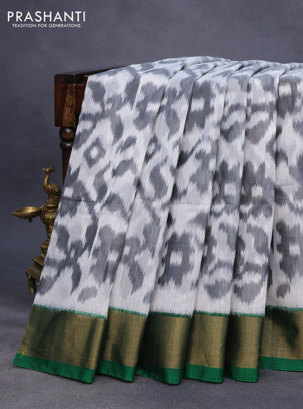 Ikat silk cotton saree off white grey and green with allover ikat weaves and zari woven border