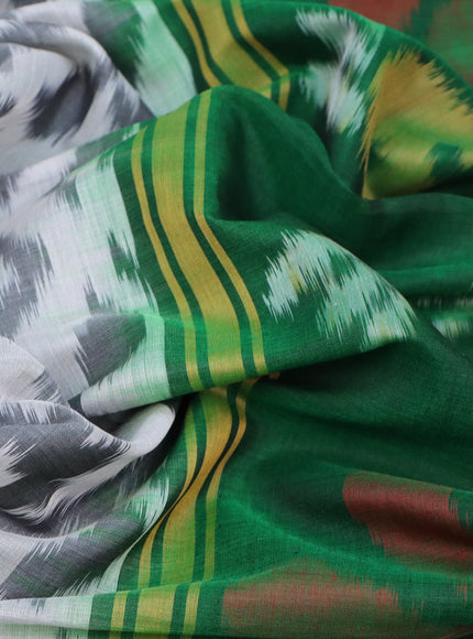 Ikat silk cotton saree off white grey and green with allover ikat weaves and zari woven border