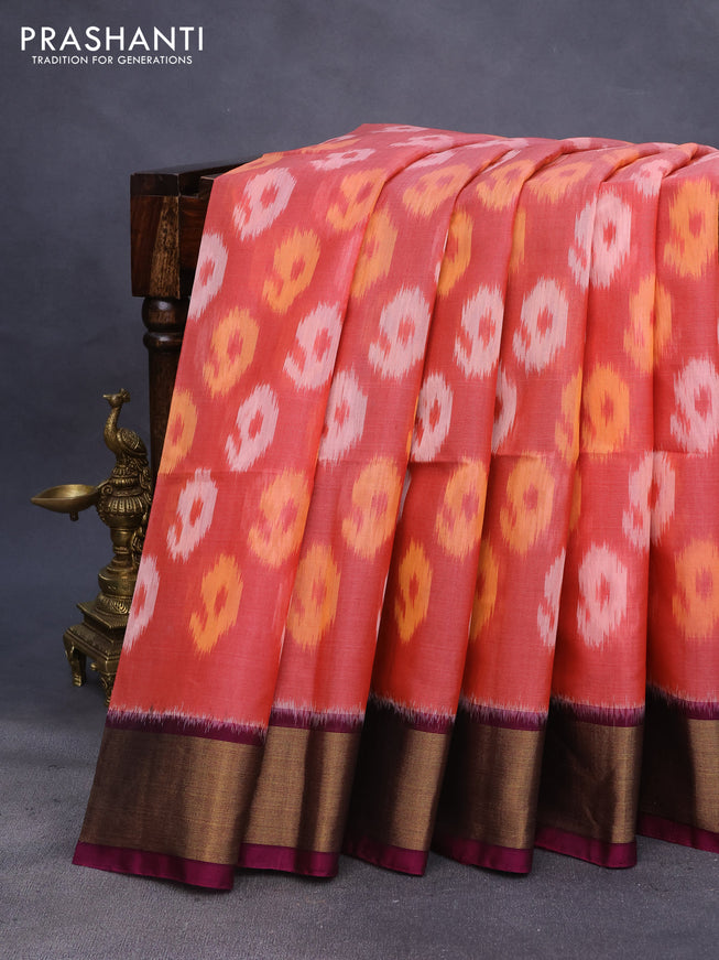 Ikat silk cotton saree peach orange and magenta pink with allover ikat weaves and zari woven border