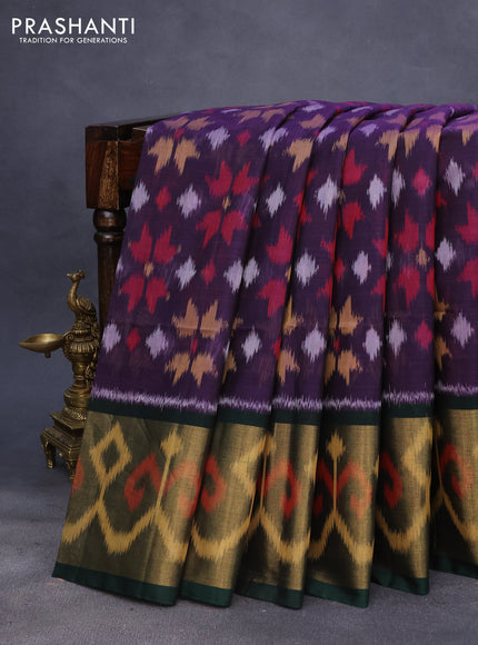 Ikat silk cotton saree deep violet and bottle green with allover ikat weaves and long ikat woven zari border