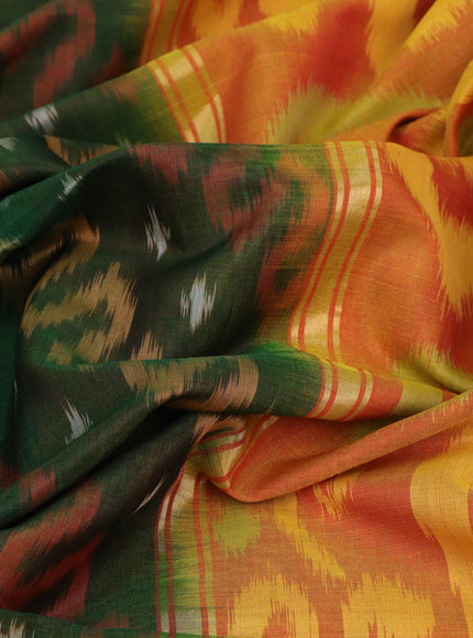 Ikat silk cotton saree bottle green and dual shade of yellowish red with allover ikat weaves and long ikat woven zari border