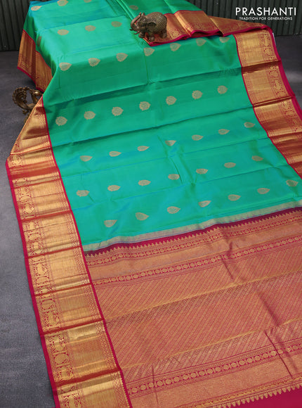 Pure kanchipuram silk saree dual shade of teal green and pink with zari woven buttas and zari woven korvai border