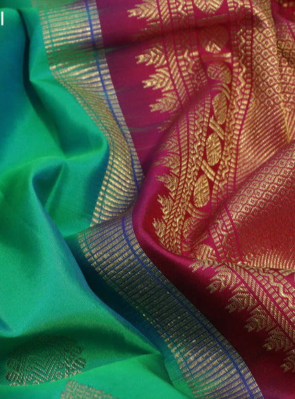 Pure kanchipuram silk saree dual shade of teal green and pink with zari woven buttas and zari woven korvai border