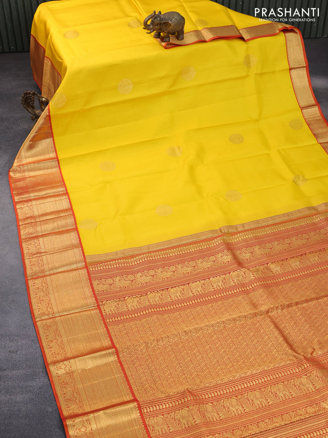 Pure kanchipuram silk saree yellow and orange with zari woven buttas and zari woven korvai border