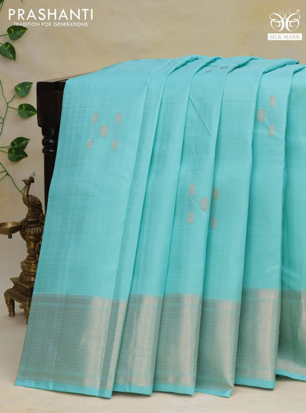 Pure kanchipuram silk saree teal blue shade with allover self emboss & silver zari buttas and silver zari woven border