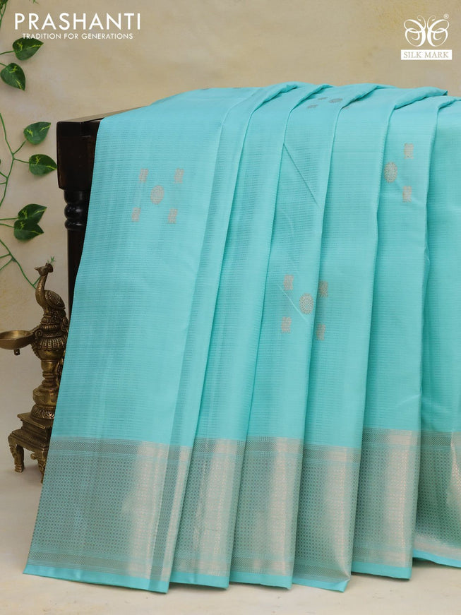 Pure kanchipuram silk saree teal blue shade with allover self emboss & silver zari buttas and silver zari woven border