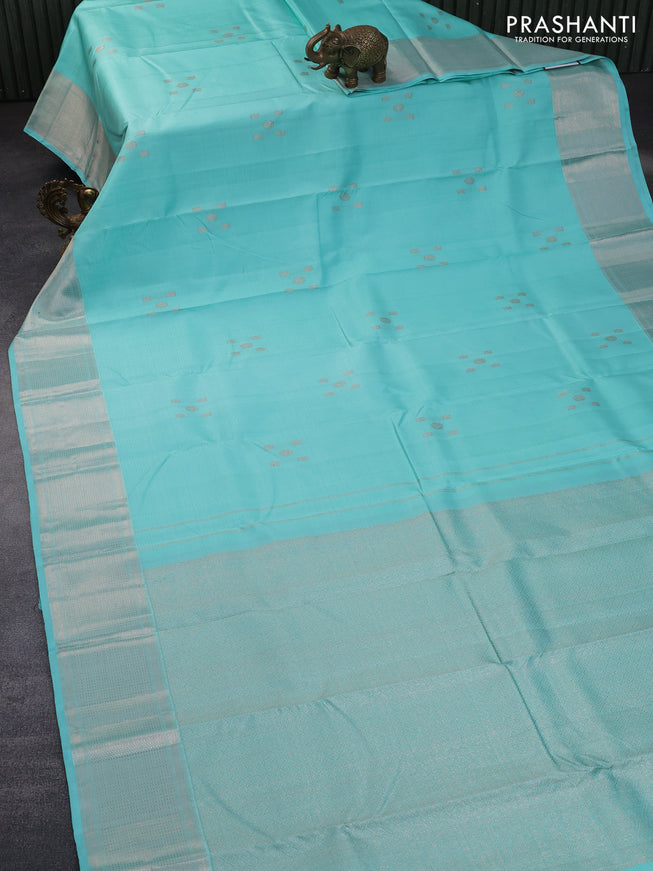 Pure kanchipuram silk saree teal blue shade with allover self emboss & silver zari buttas and silver zari woven border