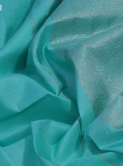 Pure kanchipuram silk saree teal blue shade with allover self emboss & silver zari buttas and silver zari woven border