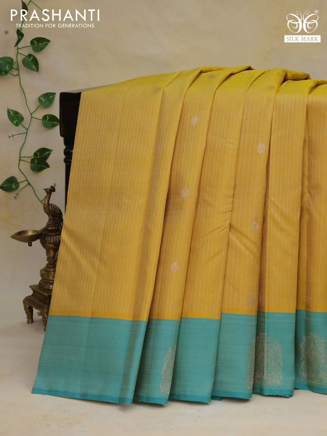 Pure kanchipuram silk saree yellow and teal blue with allover silver zari weaves and silver zari woven butta border