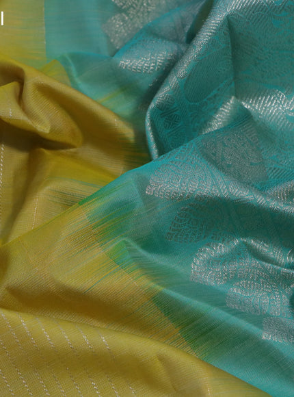 Pure kanchipuram silk saree yellow and teal blue with allover silver zari weaves and silver zari woven butta border