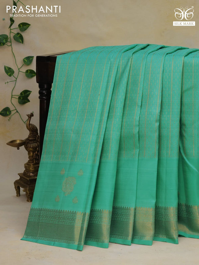 Pure kanchipuram silk saree teal green shade with allover zari weaves and zari woven border