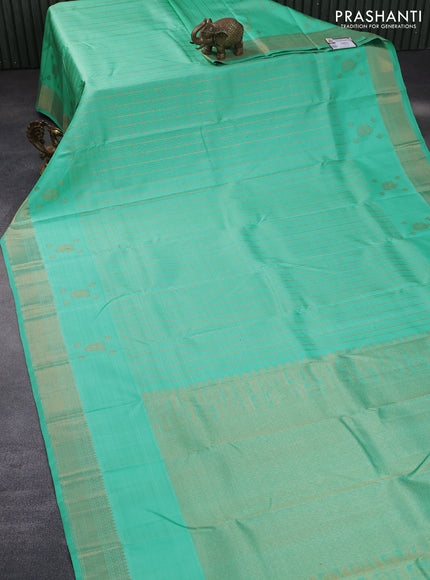 Pure kanchipuram silk saree teal green shade with allover zari weaves and zari woven border