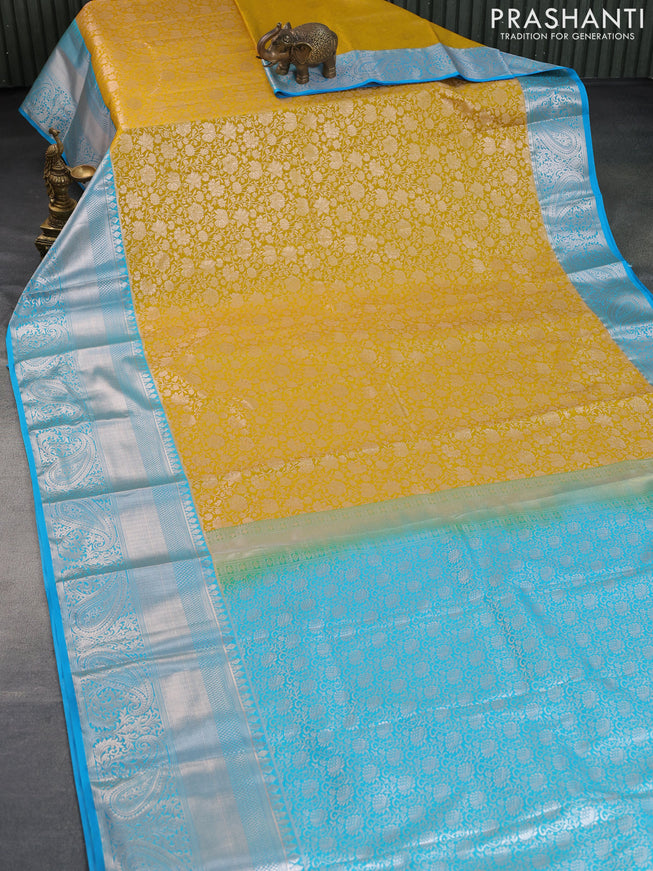 Bangalori silk saree mustard yellow and light blue with allover zari woven brocade weaves and long silver zari woven border