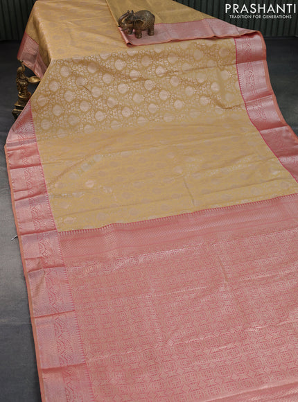 Bangalori silk saree sandal and dual shade of pastel peach with allover zari woven brocade weaves and zari woven border