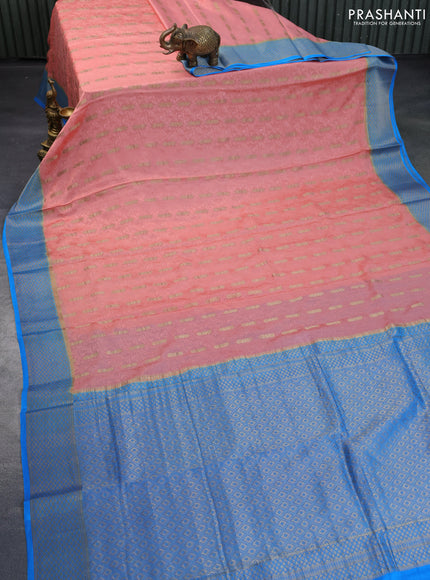 Pure mysore silk saree peach shade and blue with allover self mboss & zari buttas and zari woven border