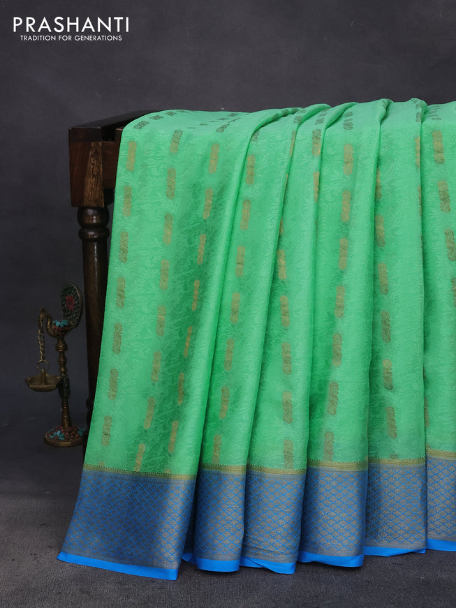 Pure mysore silk saree teal green and cs blue with allover self emboss & zari buttas and zari woven border