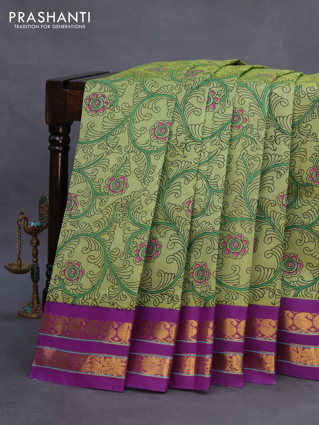 Silk cotton saree pastel green and purple with allover kalamkari prints and rettapet zari woven border