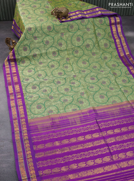 Silk cotton saree pastel green and purple with allover kalamkari prints and rettapet zari woven border