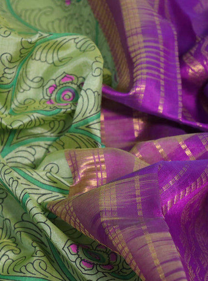 Silk cotton saree pastel green and purple with allover kalamkari prints and rettapet zari woven border