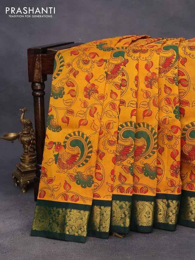 Silk cotton saree mustard yellow and green with allover kalamkari prints and zari woven korvai border