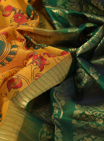 Silk cotton saree mustard yellow and green with allover kalamkari prints and zari woven korvai border