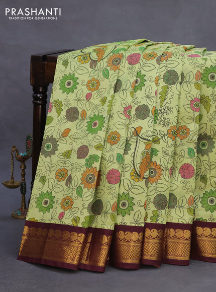 Silk cotton saree pastel green and wine shade with allover kalamkari prints and zari woven korvai border