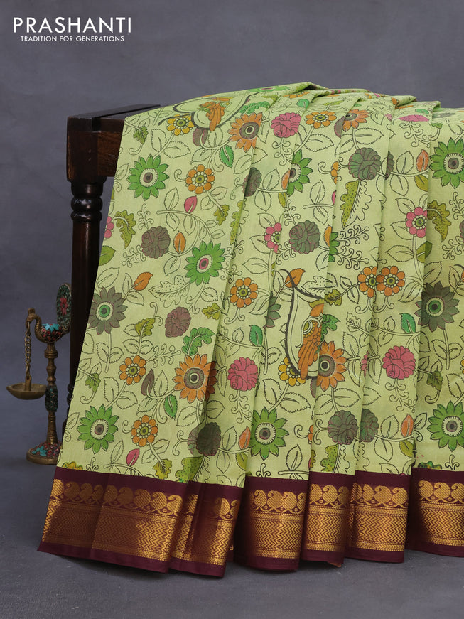 Silk cotton saree pastel green and wine shade with allover kalamkari prints and zari woven korvai border