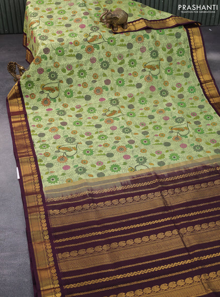 Silk cotton saree pastel green and wine shade with allover kalamkari prints and zari woven korvai border