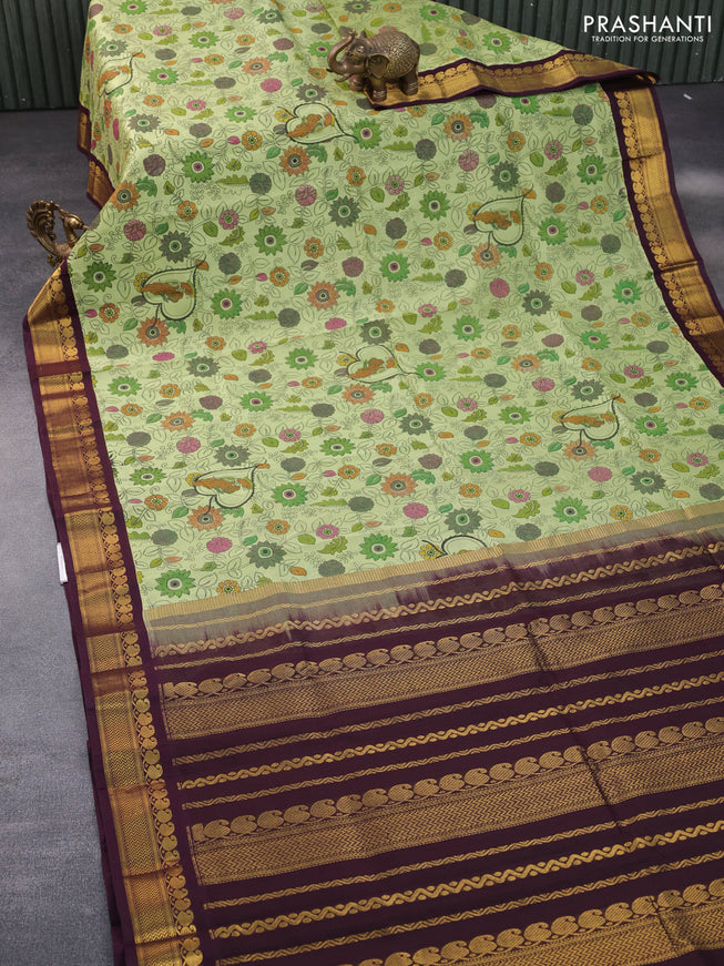 Silk cotton saree pastel green and wine shade with allover kalamkari prints and zari woven korvai border