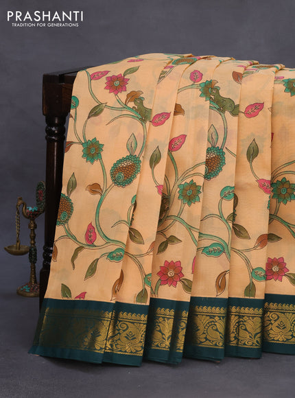 Silk cotton saree pale orange and peacock green with allover kalamkari prints and zari woven korvai border