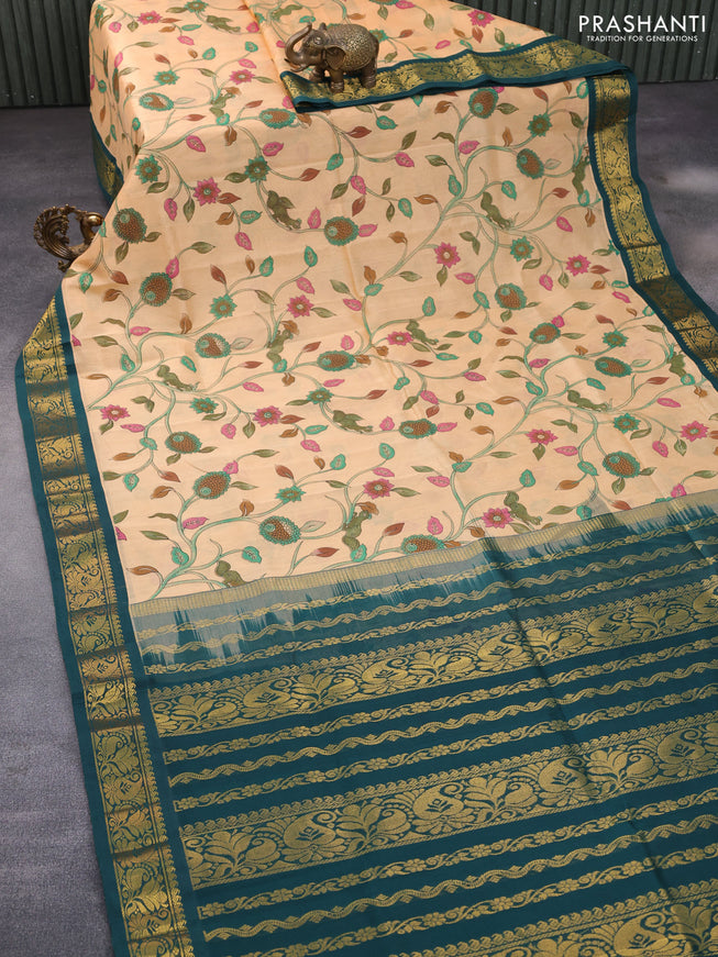 Silk cotton saree pale orange and peacock green with allover kalamkari prints and zari woven korvai border