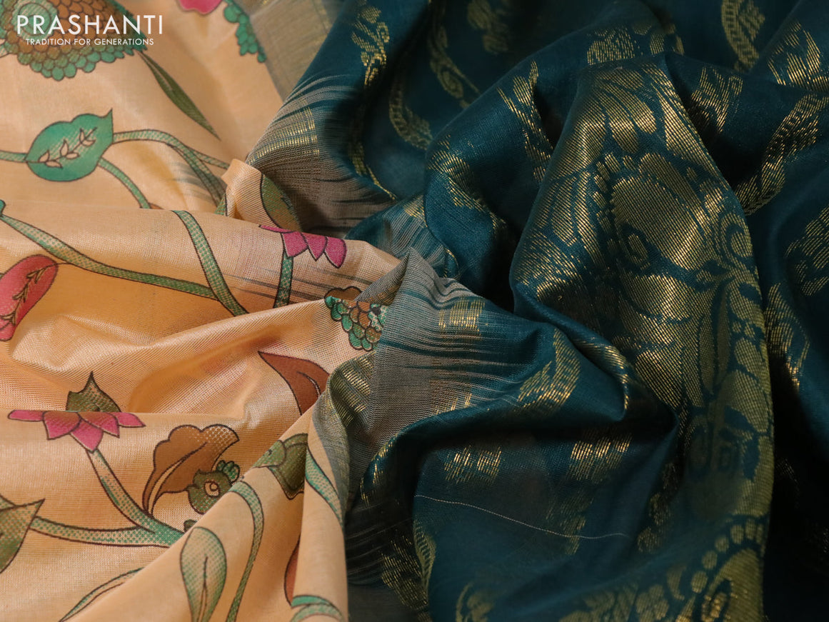 Silk cotton saree pale orange and peacock green with allover kalamkari prints and zari woven korvai border