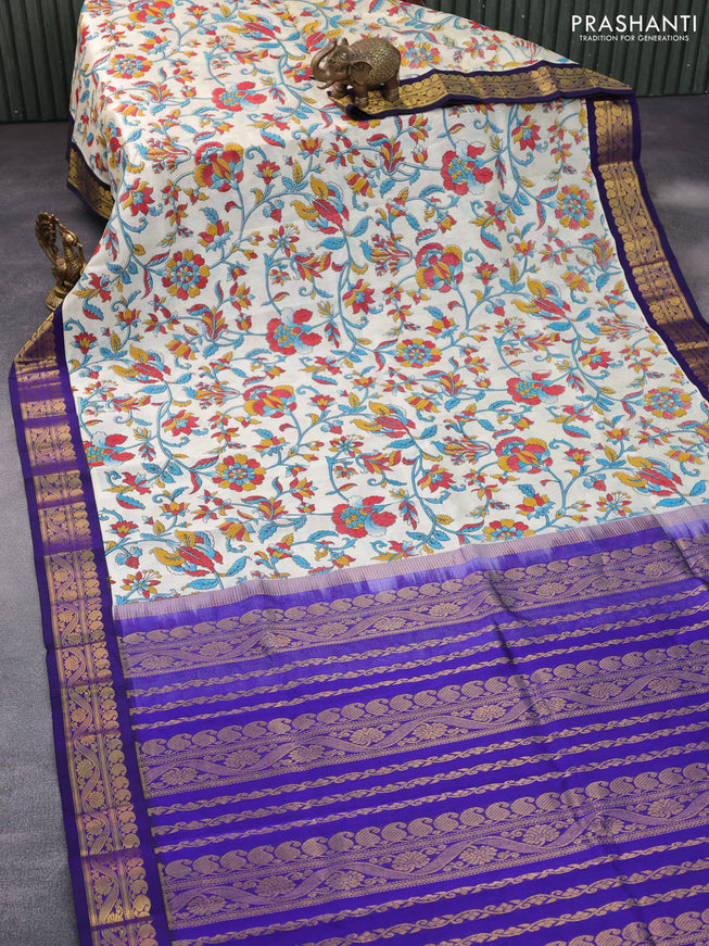 Silk cotton saree cream and blue with allover kalamkari prints and paisley zari woven korvai border