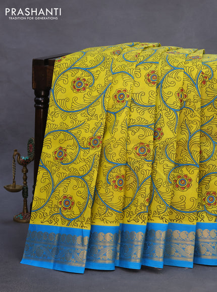 Silk cotton saree lime yellow and cs blue with allover kalamkari prints and paisley zari woven korvai border