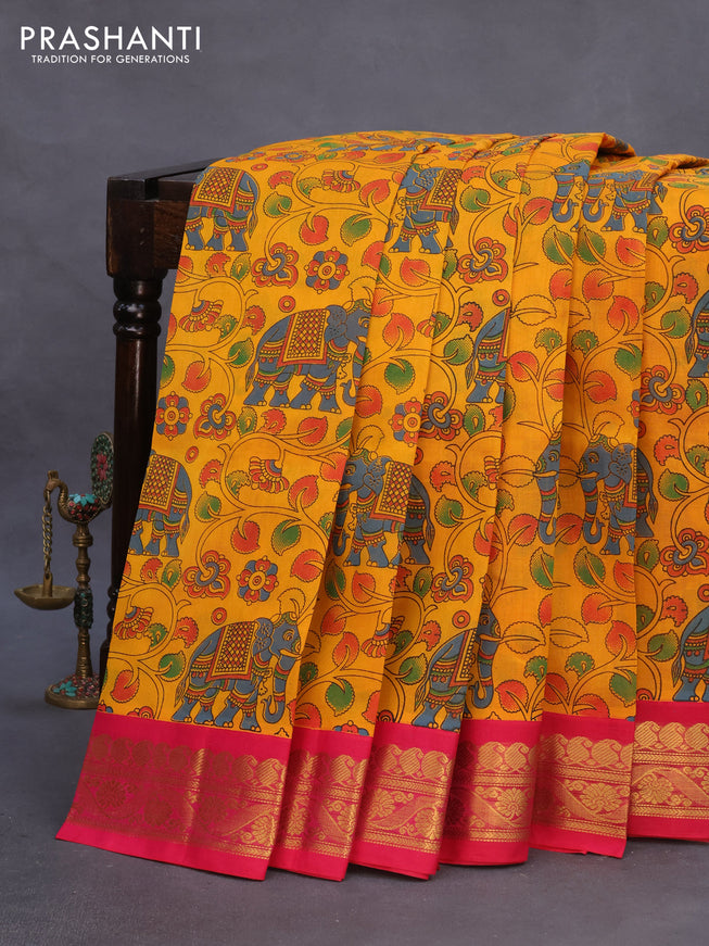 Silk cotton saree mustard yellow and pink with allover kalamkari prints and paisley zari woven korvai border