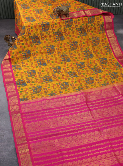 Silk cotton saree mustard yellow and pink with allover kalamkari prints and paisley zari woven korvai border